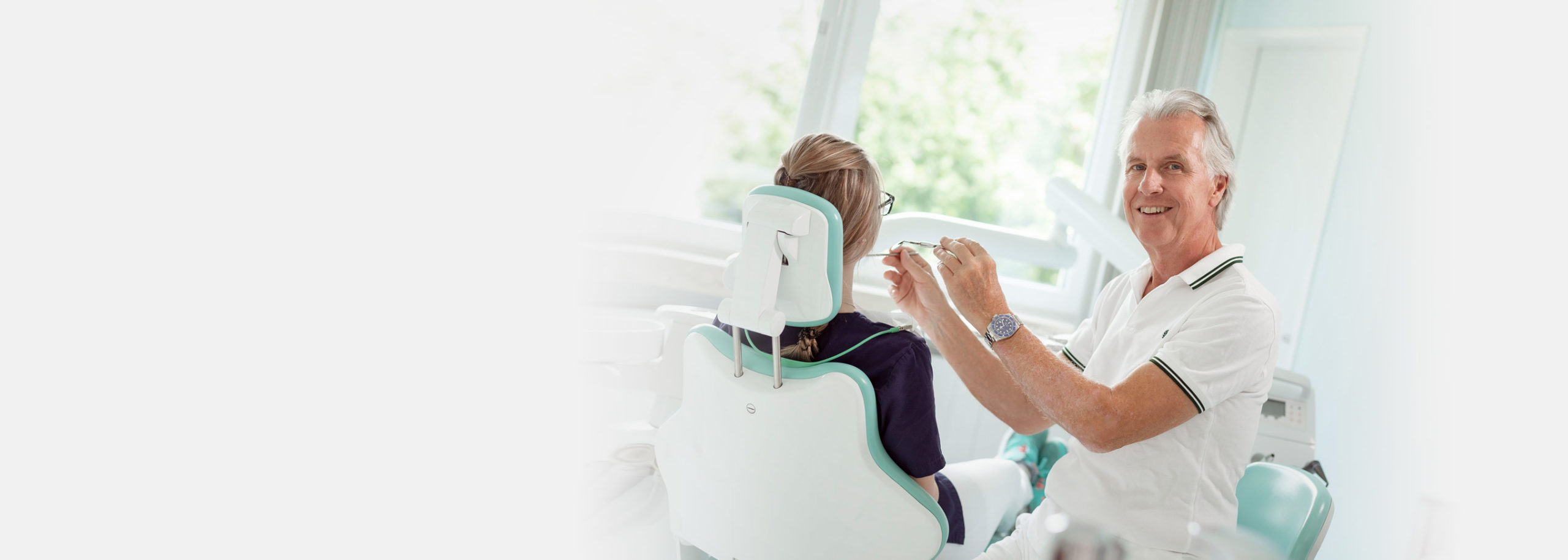 Dentist showing X-ray image to patient